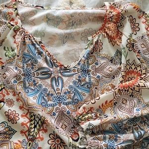 Polyester tunic, great with jeans or dress pants, very colorful, super comfy